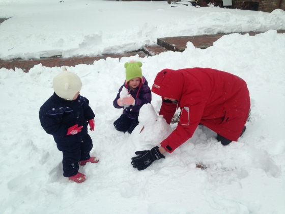 They are loving building the snowman, Olaf